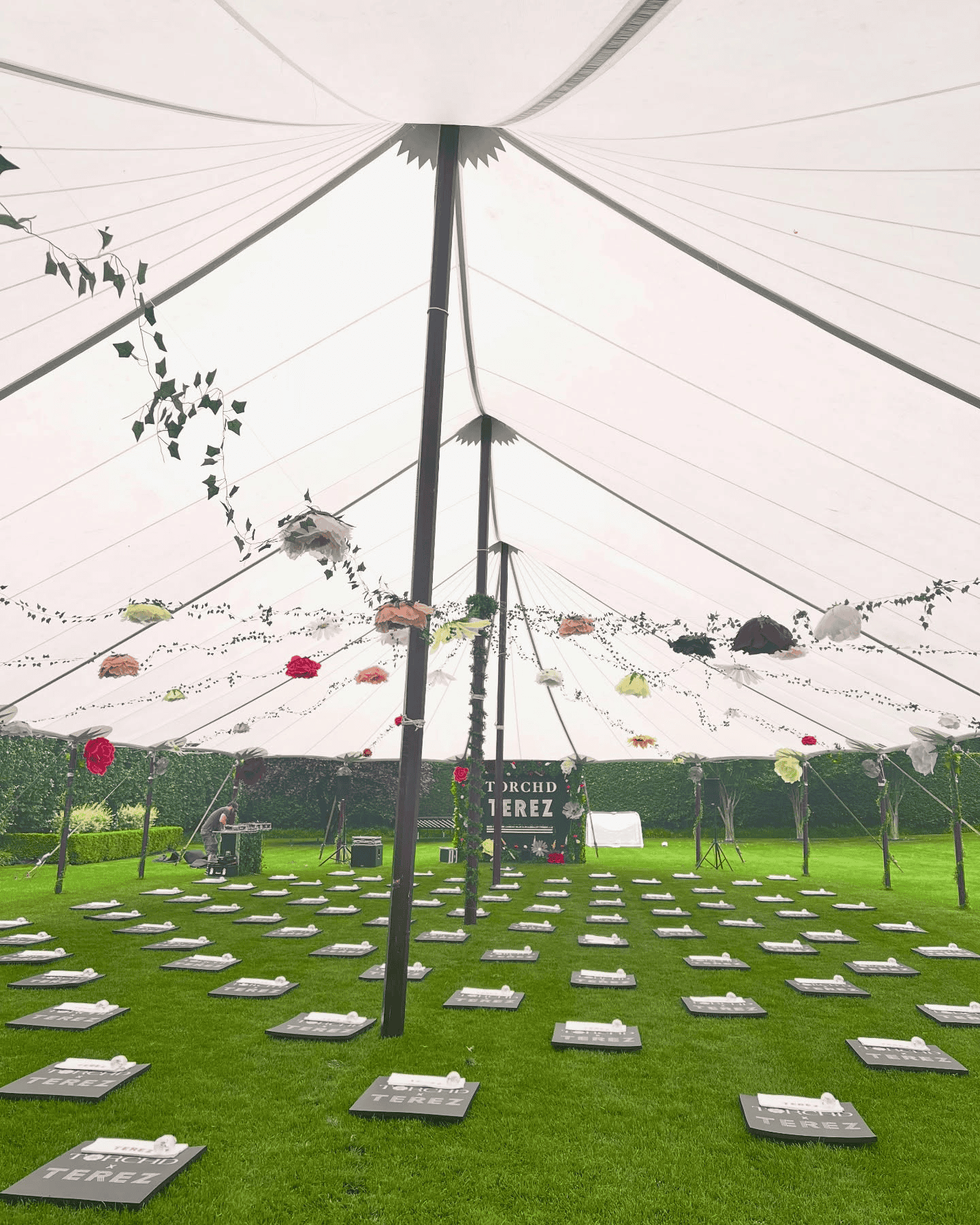 Inside a luxury event tent install with lighting and furnishings