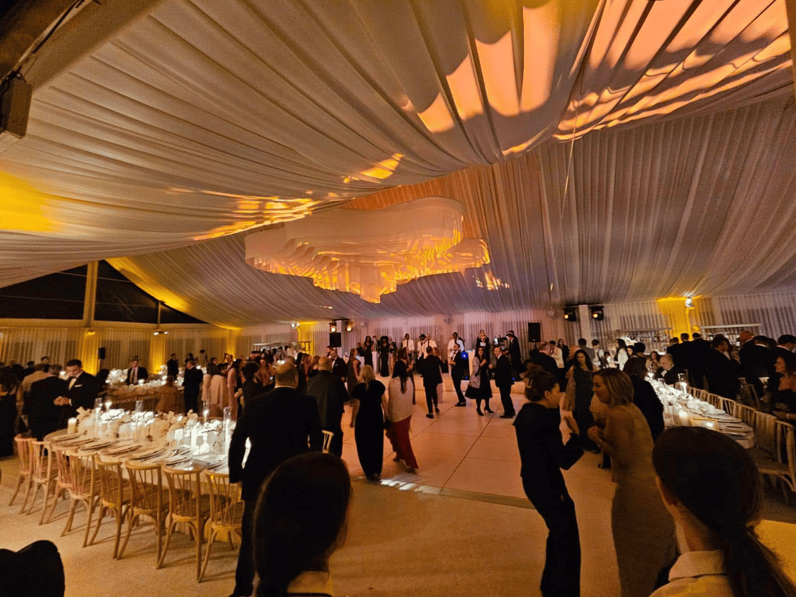 Evening luxury tent install lit from inside