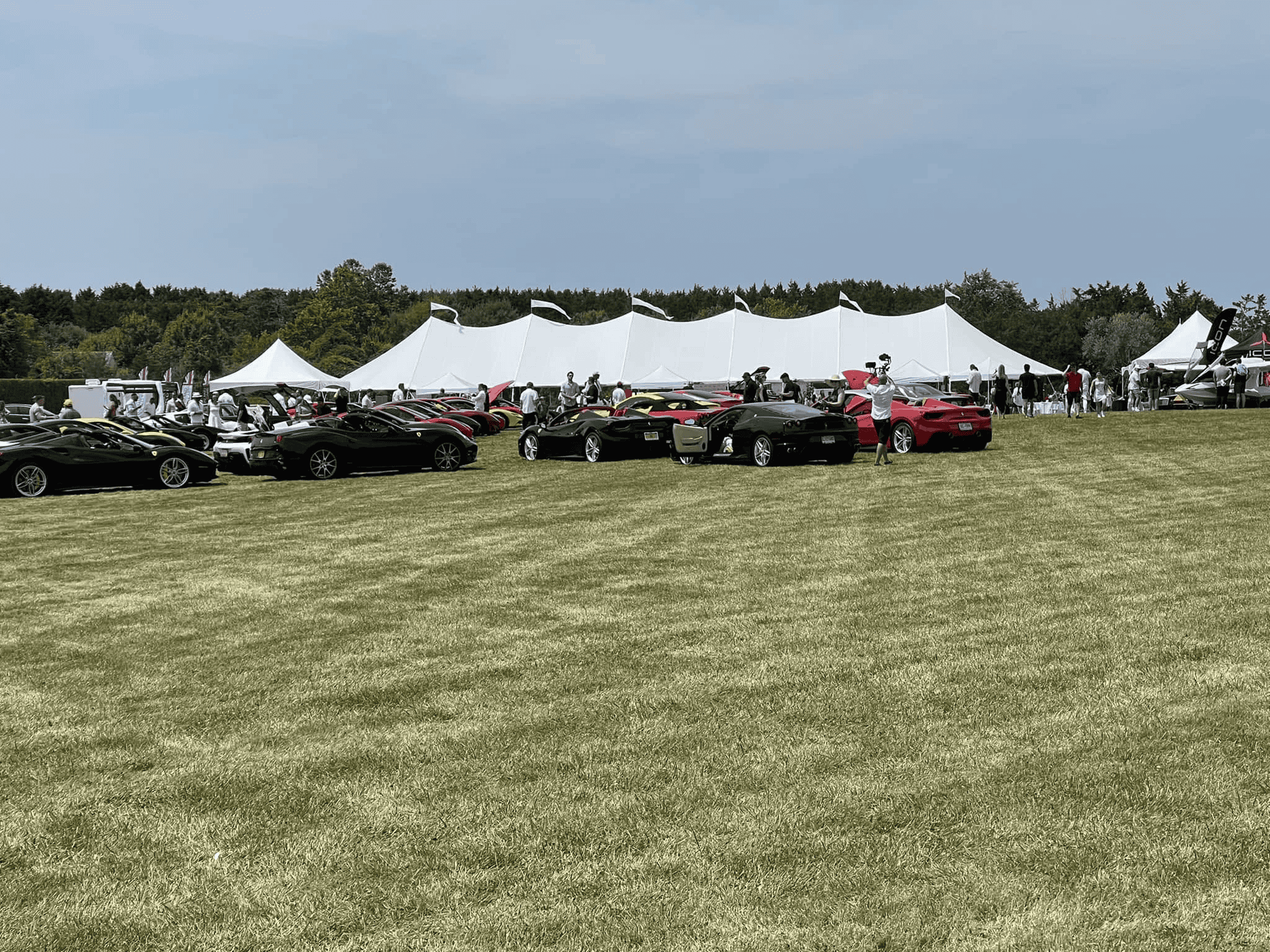 Corporate event tent installed on a Long Island property with the crew finishing the setup