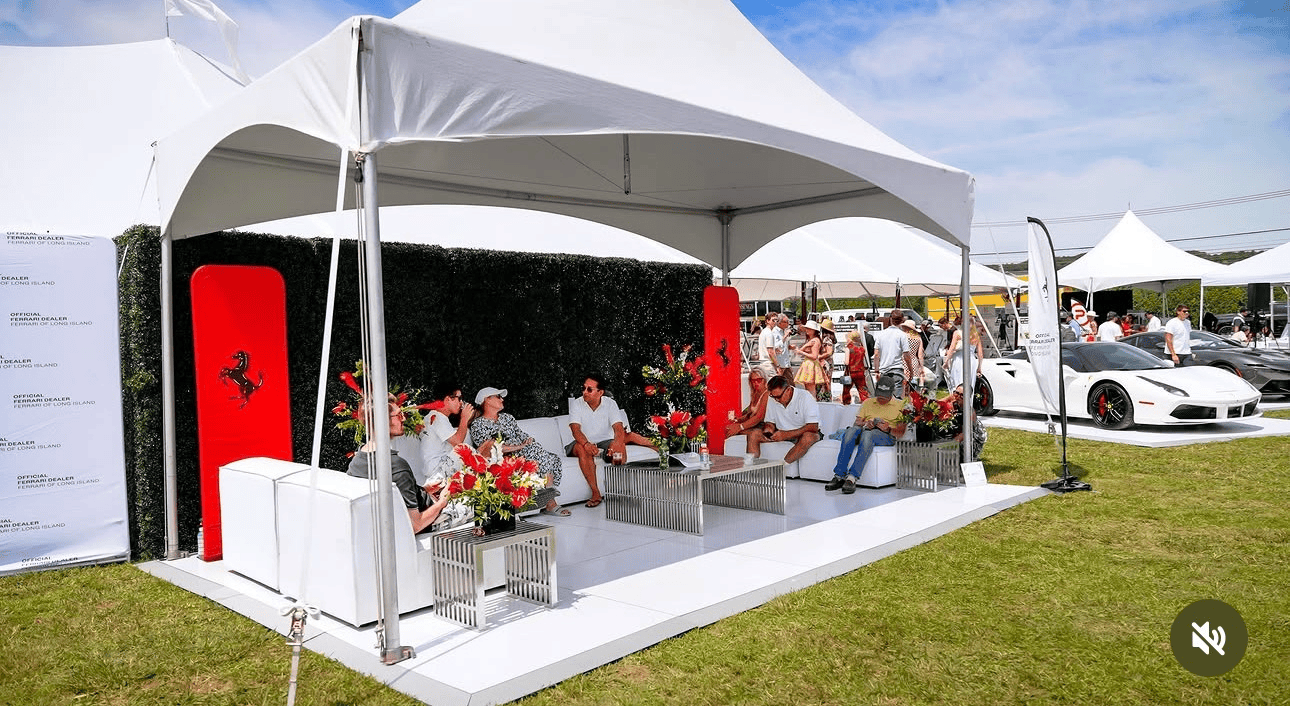 Business event tent with seating rows set for a presentation