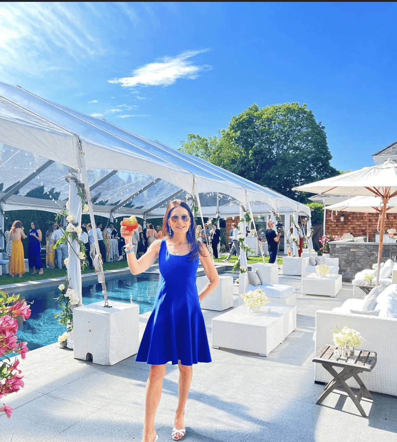 Backyard party tent with seating set on a lawn