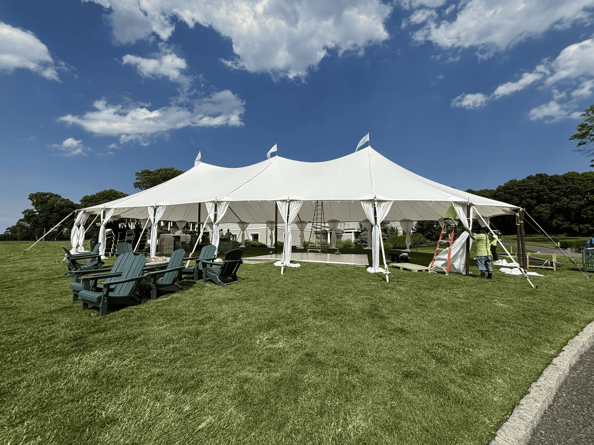 Evening private event with a lit seating area under cover