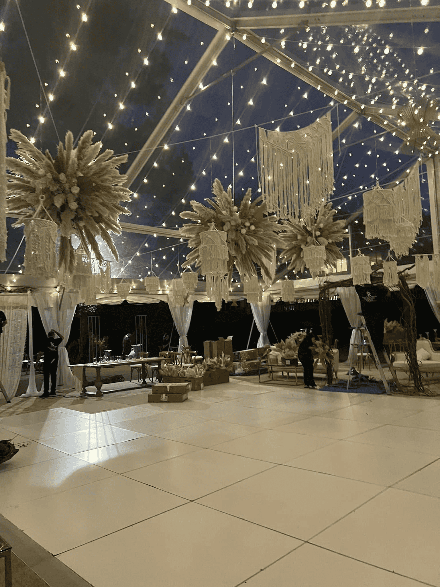 Clear top tent set over a patio with window walls fitted along one side
