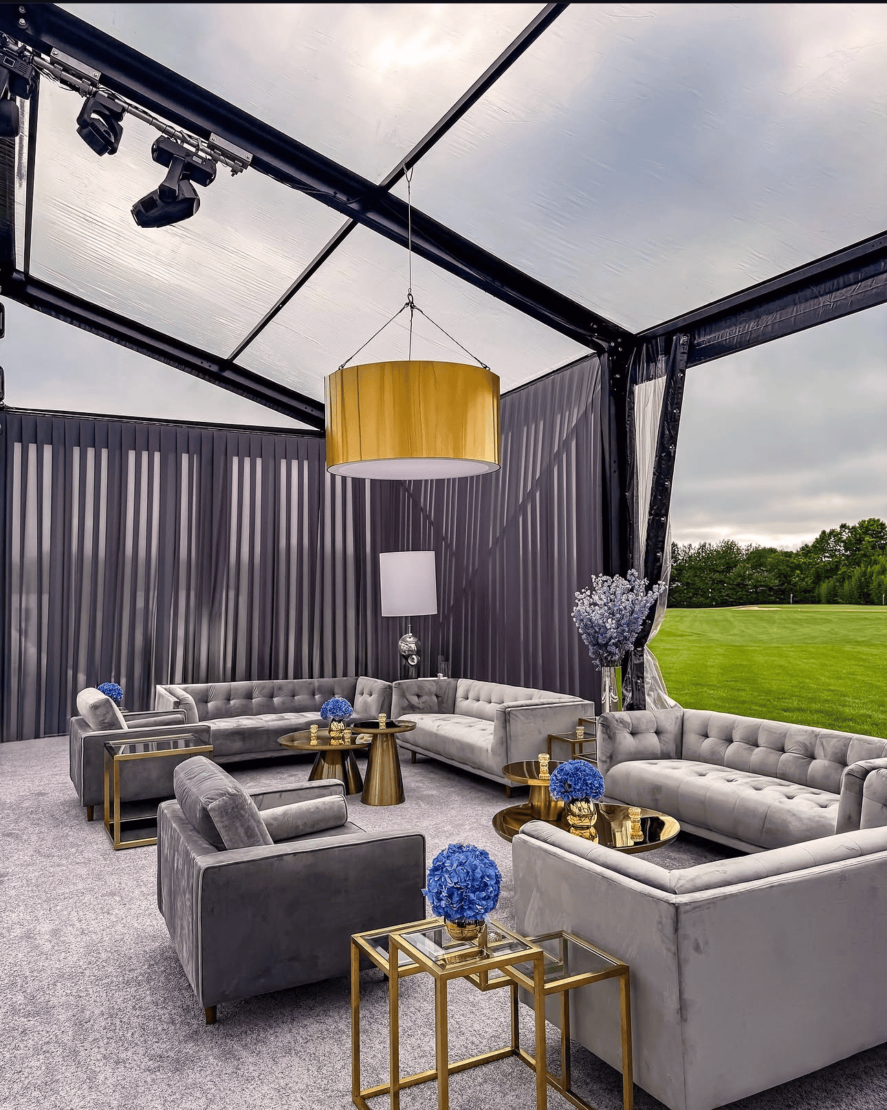 Glass doors set into the gable end of a low profile event structure